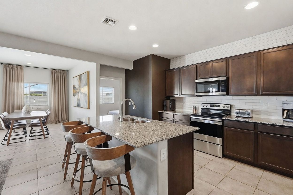 Open Concept Kitchen and Dining Room.  Curtains/Art virtually staged