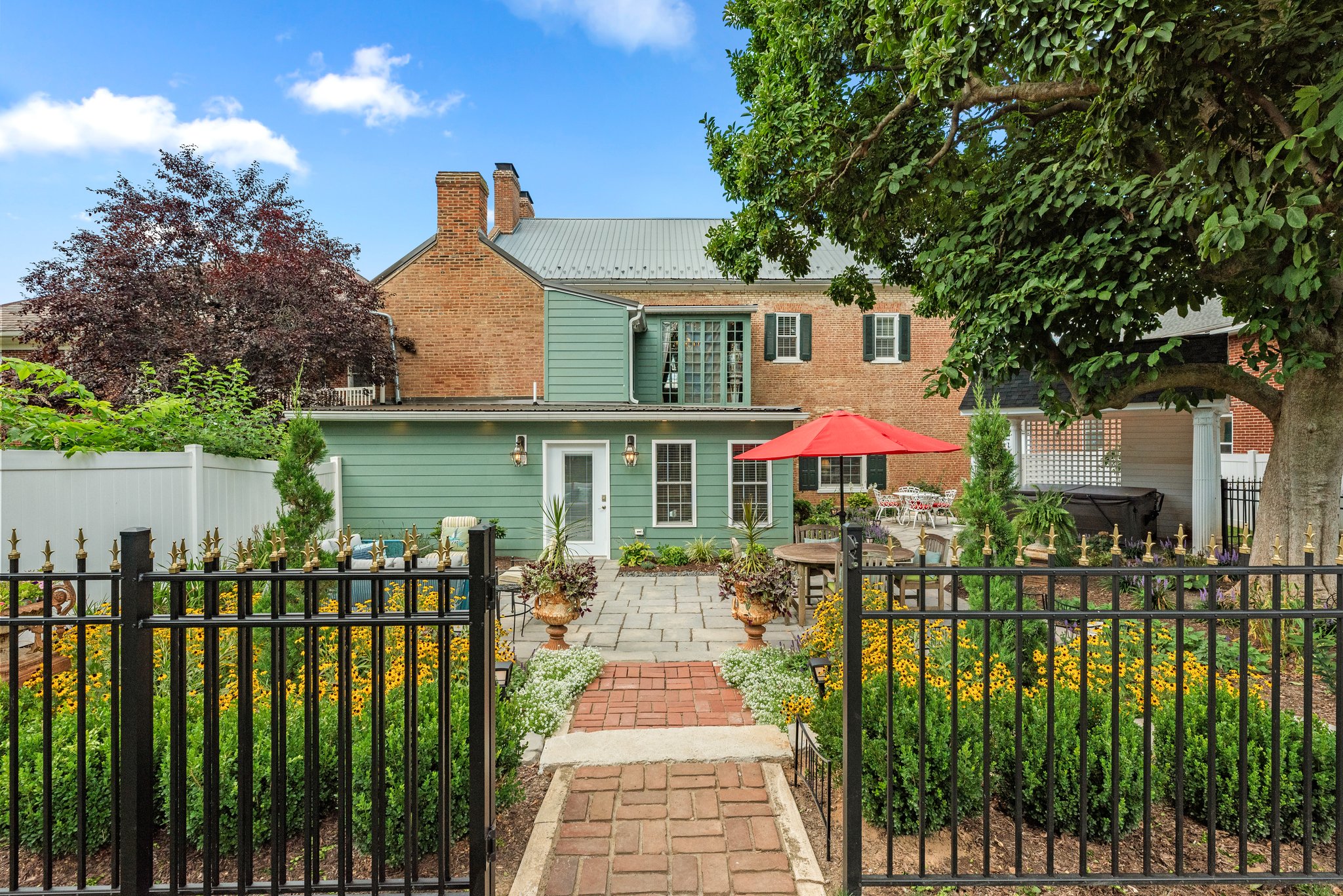 A lovely garden graces the rear of the home