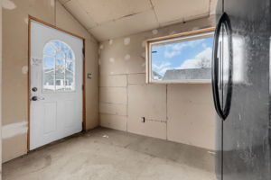 Rear access from a spacious fenced in yard