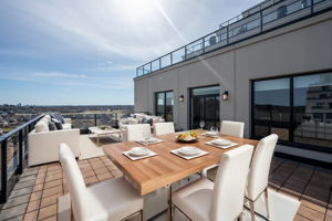 This photo as been virtually staged to show what the terrace could look like with patio furniture