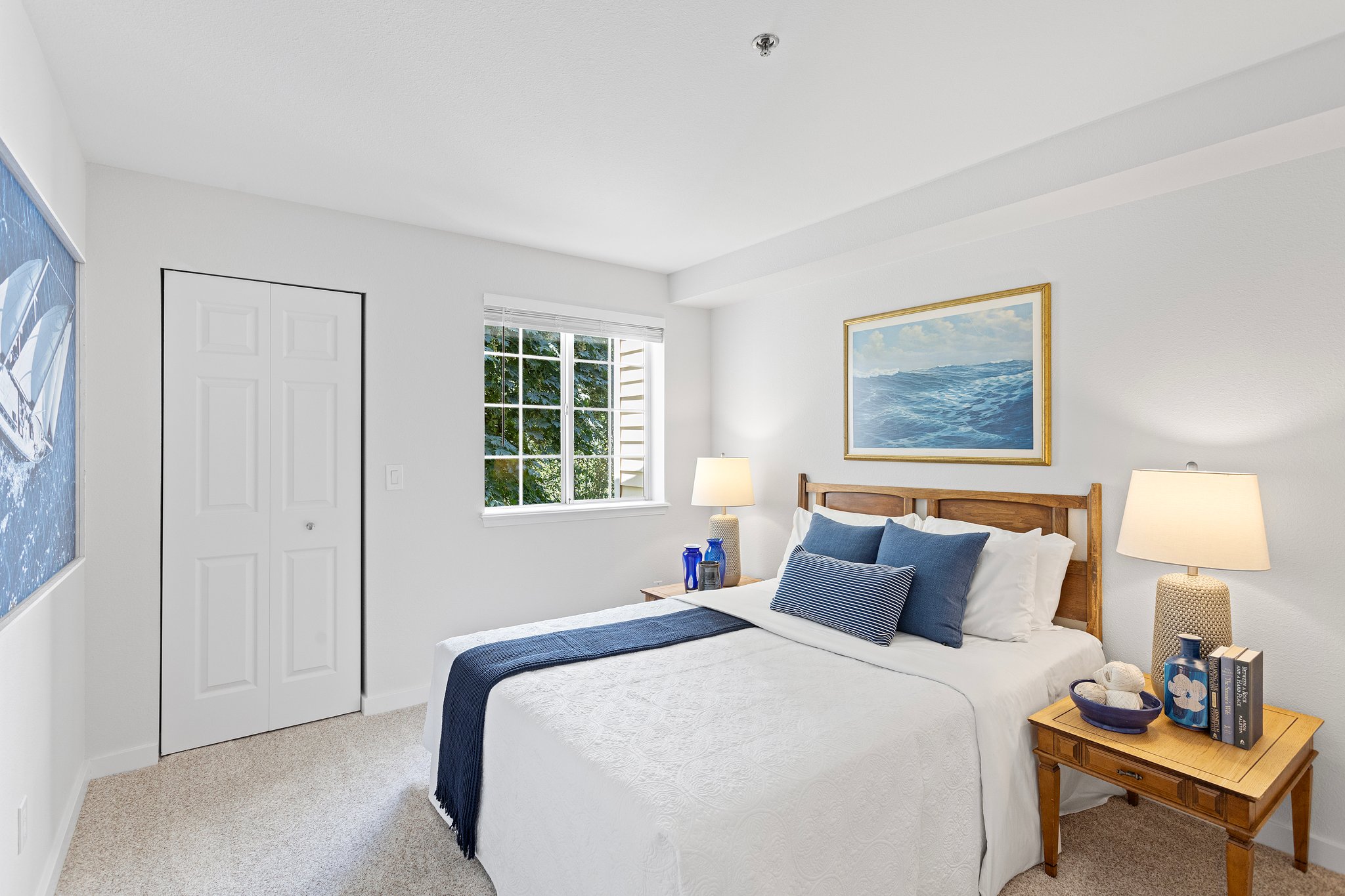 Serene views await in the spacious primary bedroom, complete with a walk-in closet for ample storage. Enjoy the convenience of direct access to the updated bathroom and laundry room just across the hallway, streamlining your daily routines.