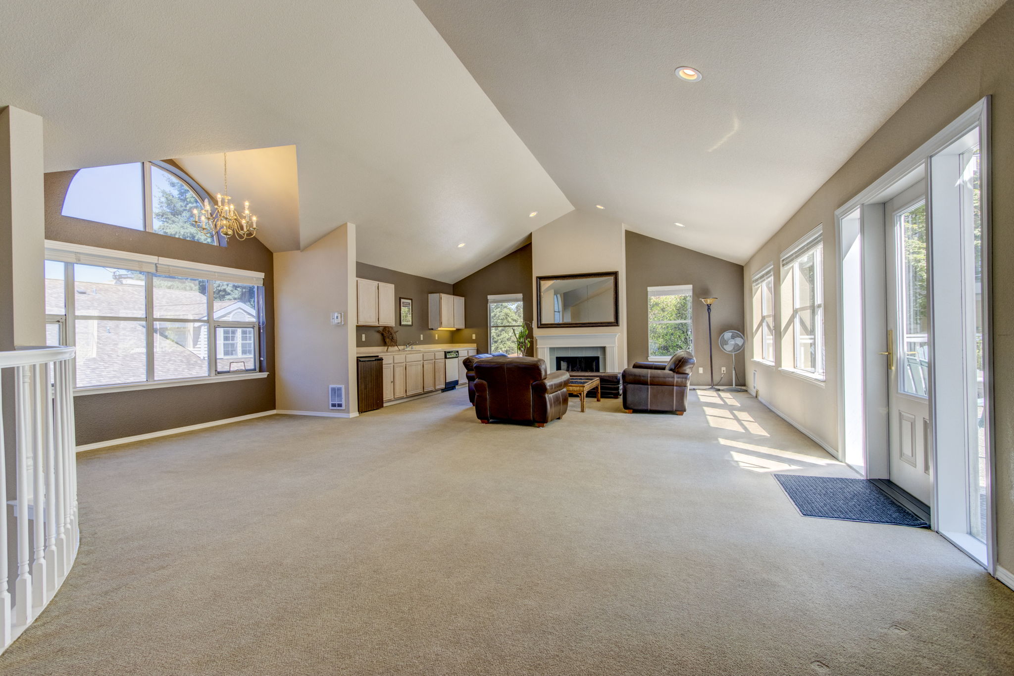 Gathering Hall with Kitchenette, fireplace, and festive outdoor patio.