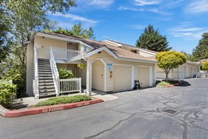 Embrace the tranquility, nestled on the hillside in this delightful end unit condo. A peaceful retreat surrounded by stunning greenery, offering a perfect blend of nature and comfort.