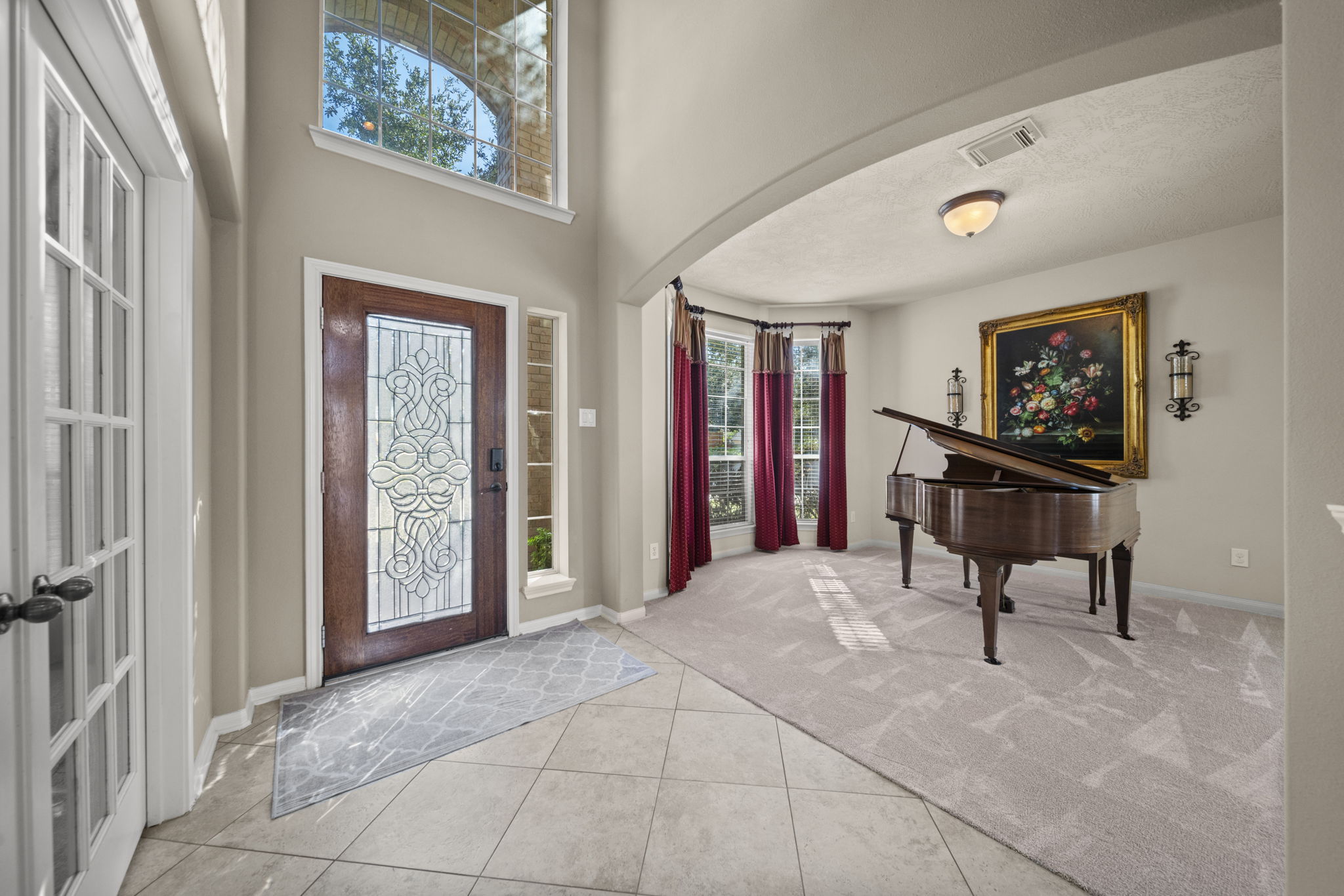 The entryway opens up with towering ceilings!