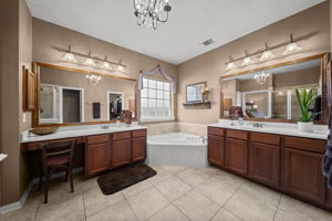 Enjoy double sinks w/ a vanity feature and cultured marble counter tops.