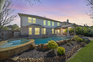 Beautiful landscaping surrounds the serene pool!