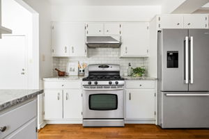 Gorgeous white kitchen with stainless steel appliances