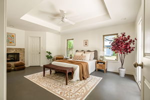 Primary Bedroom with finishes concrete floors.
