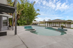 Enjoy a dip in the pool overlooking your boat dock