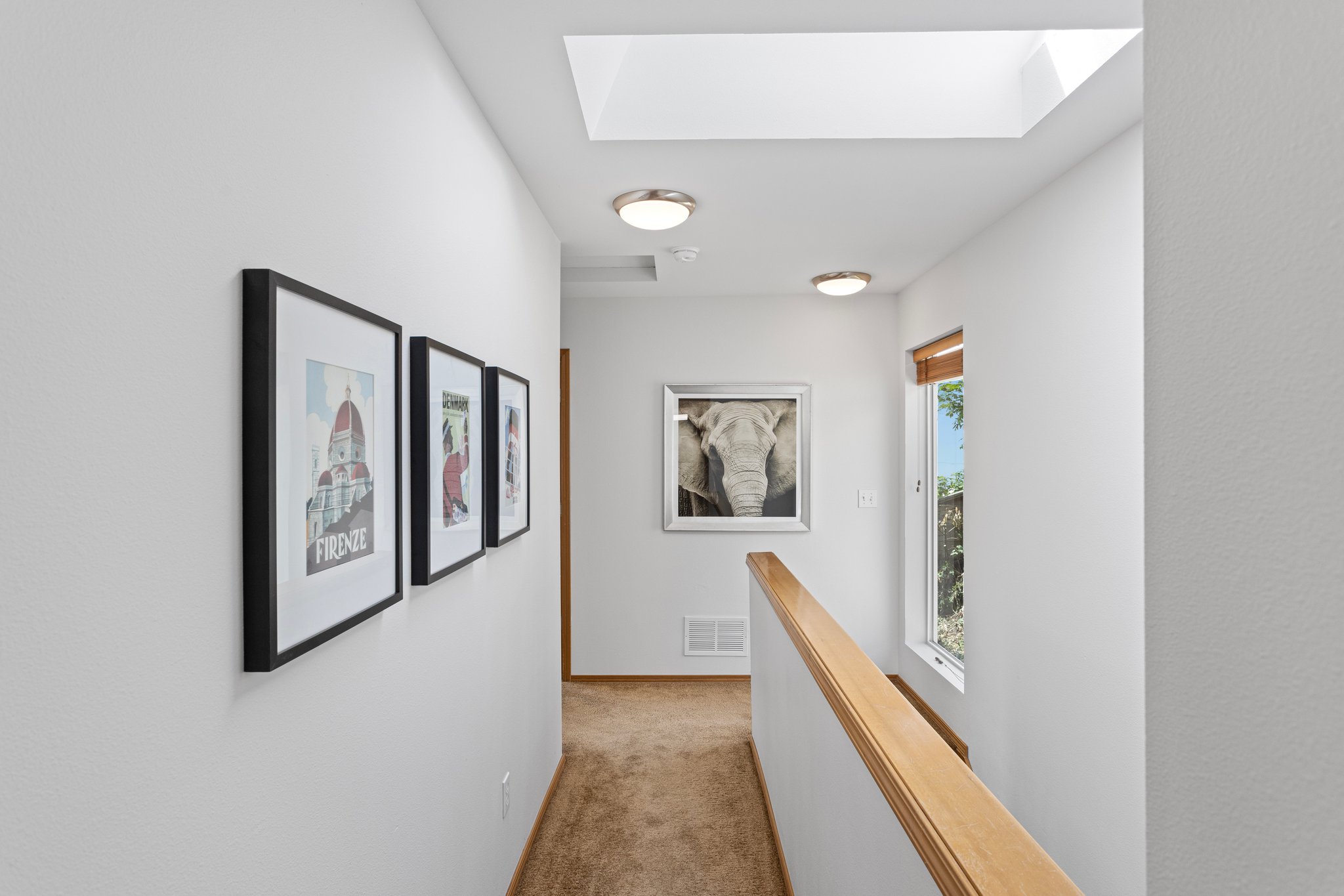 Upstairs, this sky-lit hallway with a large landing window will make you feel like you’re living in a cloud, flooding the space with natural light, and enhancing the spacious uplifting vibe of the bedroom floor.