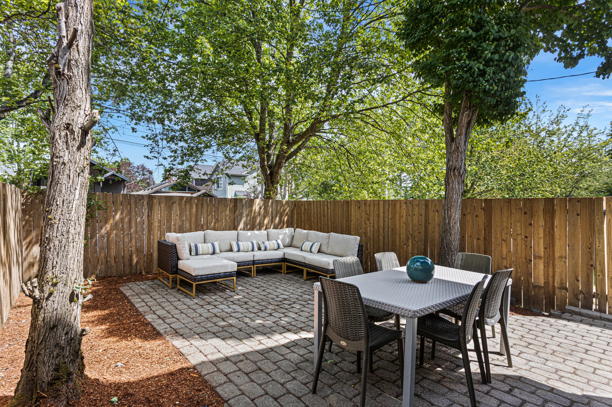 Step outside to your private retreat: a fenced outdoor patio, perfect for sipping your morning coffee, reading, or throwing a festive barbecue party.