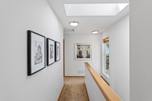 Upstairs, this sky-lit hallway with a large landing window will make you feel like you’re living in a cloud, flooding the space with natural light, and enhancing the spacious uplifting vibe of the bedroom floor.