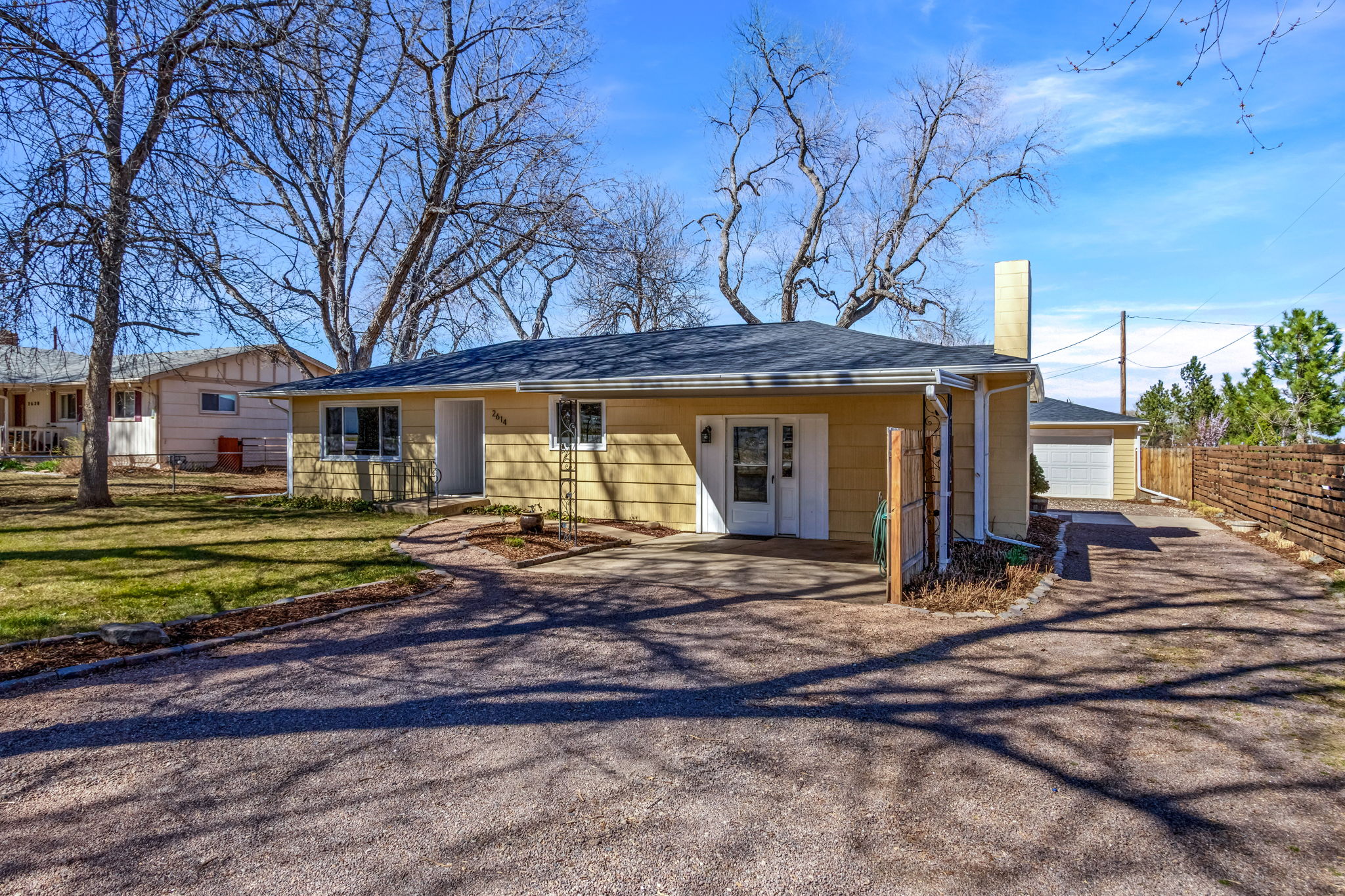 Brand new roof, pre-inspected, move-in ready!  Carport, 1 car detached garage, and lots of driveway space for RV and vehicles - No HOA!