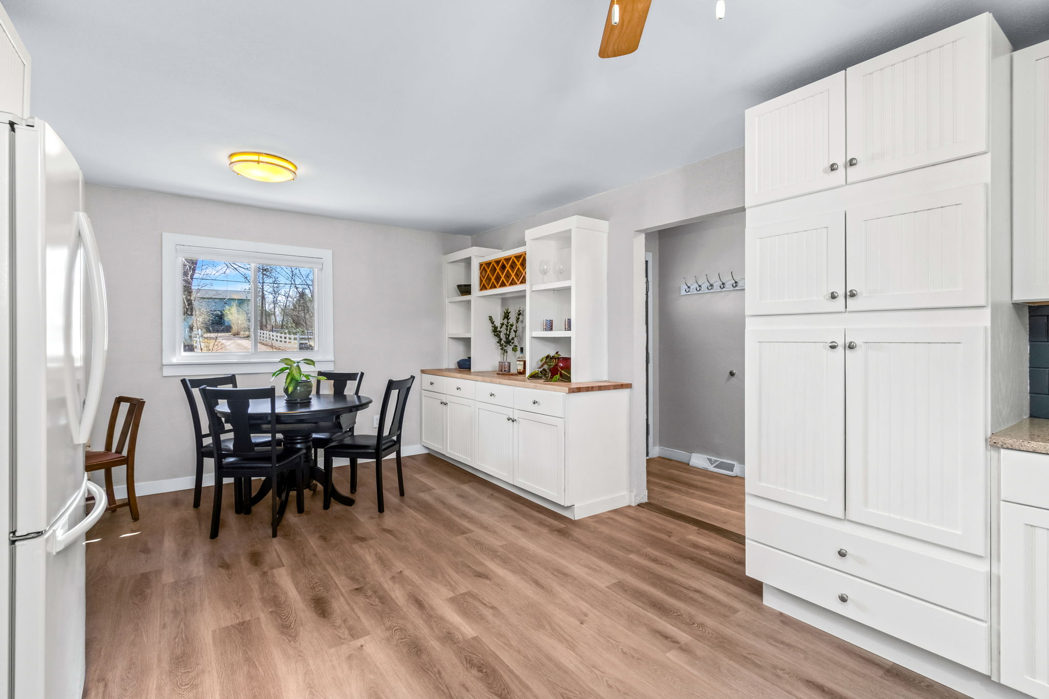 Built in cabinets for all your storage and displays. Kitchen is located just off the entry way and looking south to the front of the house.