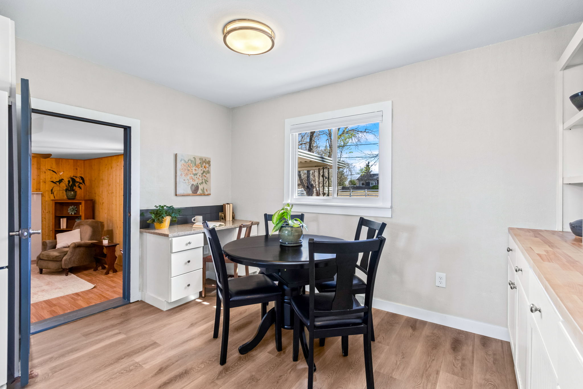 Eat-in kitchen area as well as built in desk. The kitchen connects the two living areas and bedrooms, which are situated on either side of the house.