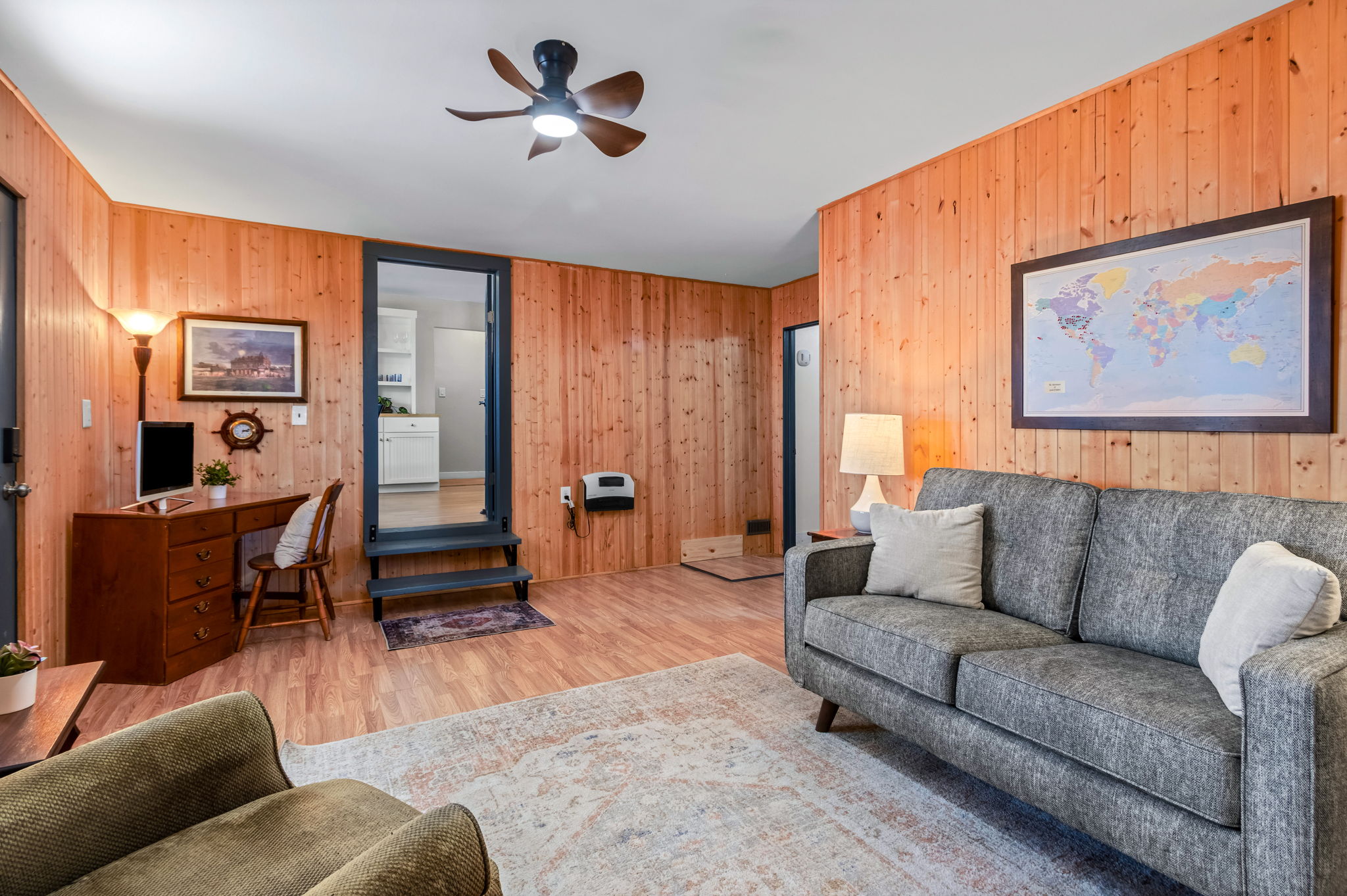 The family room is located off the kitchen, next to the 2nd bedroom, and with direct access to both the front and backyards.