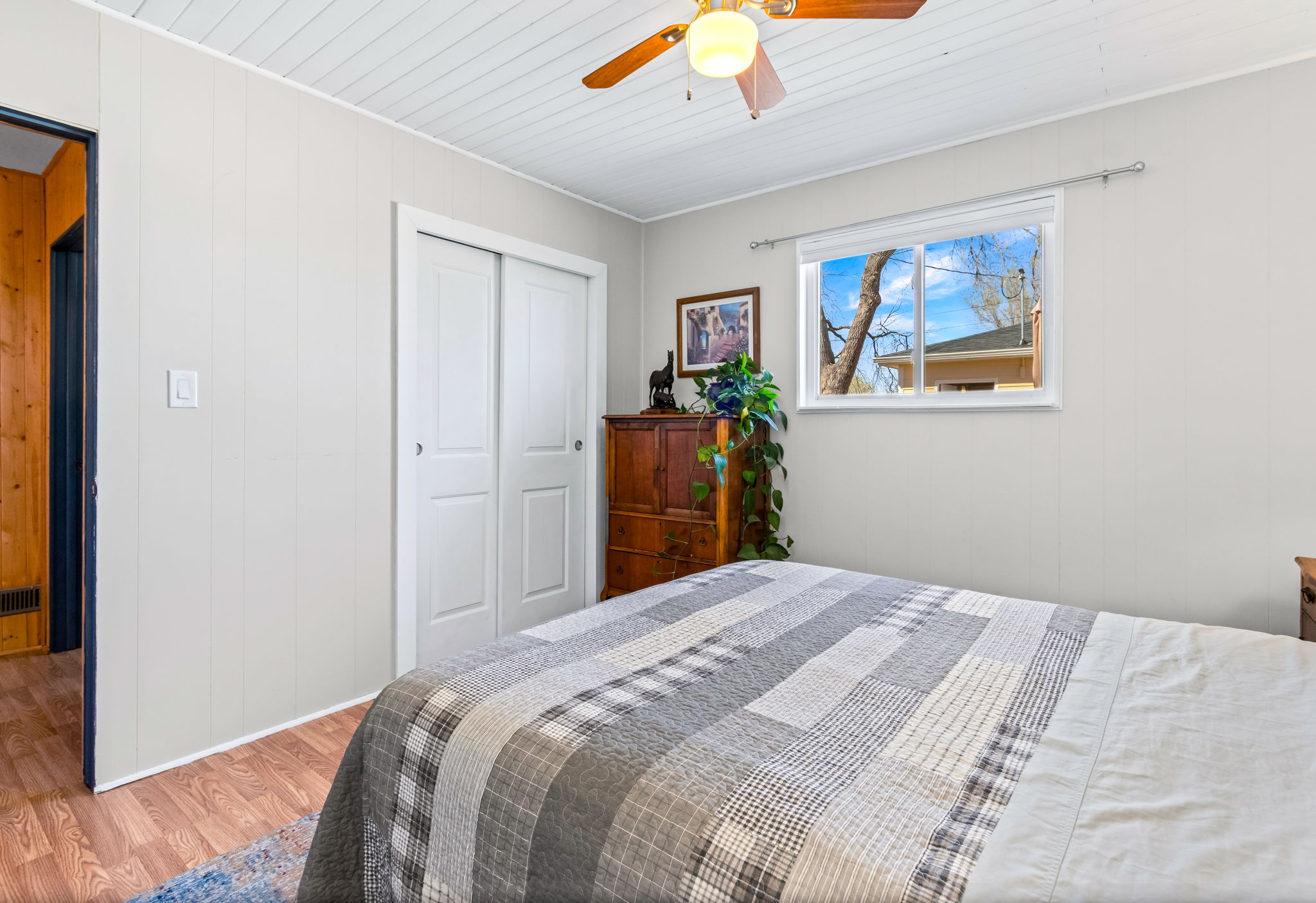 Bedroom 2 is located off the family room, overlooking the private back patio and backyard.