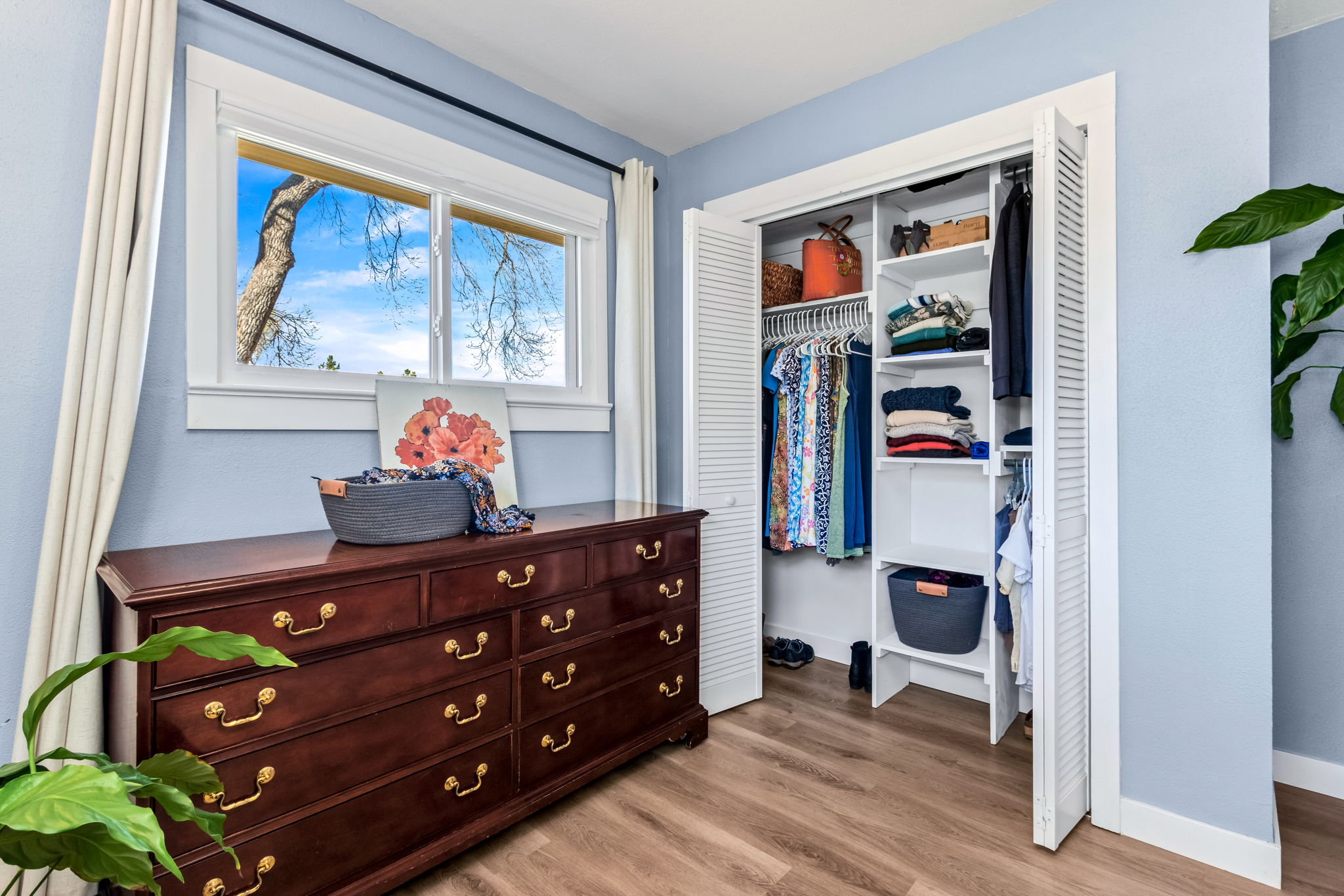 One of two closets in the primary bedroom. This closet organizer makes all the difference!