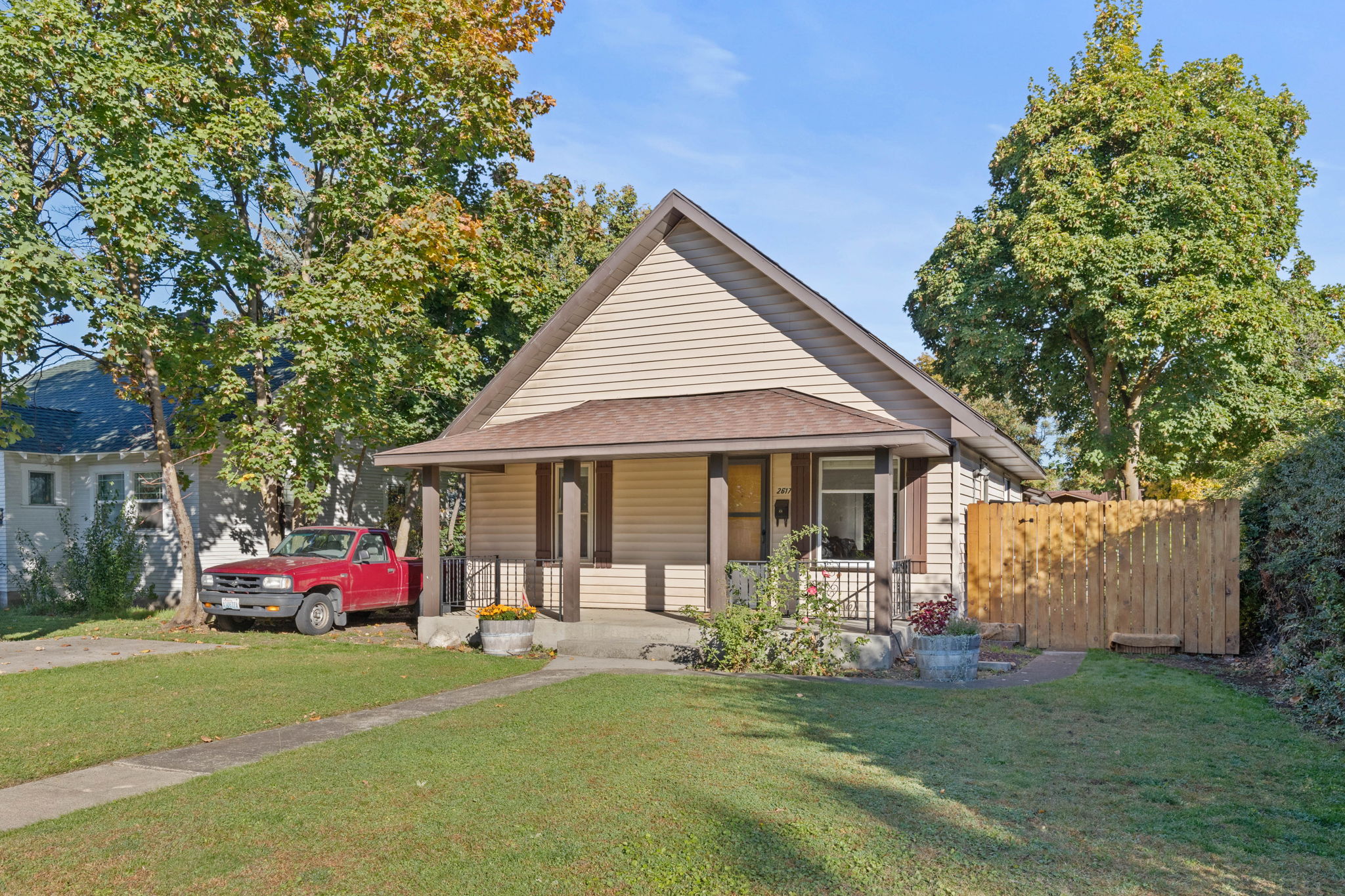 Built in 1909, This home has vinyl siding and a fenced back yard.