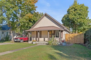 Built in 1909, This home has vinyl siding and a fenced back yard.
