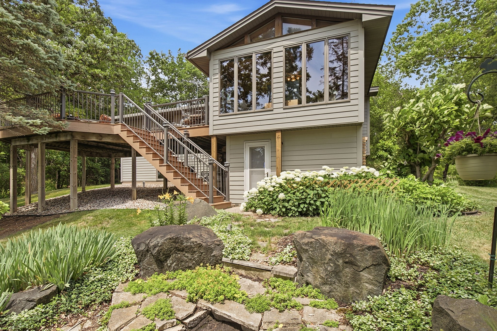 Exterior looking toward four-season porch and deck.