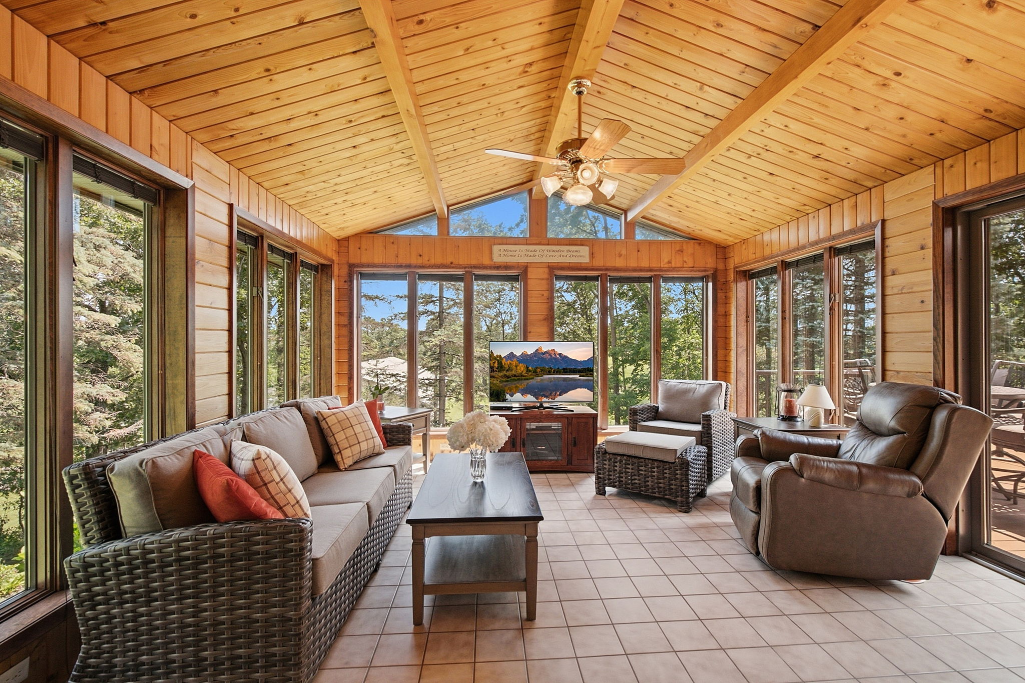 Tongue-and-groove cedar four-season sunroom with Andersen Windows.