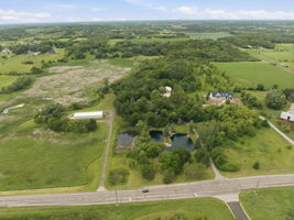 Aerial view of 9.83 acres with property lines just to the right of the two driveways shown.