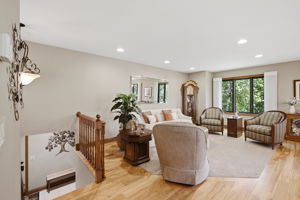 Living room with red birch flooring.