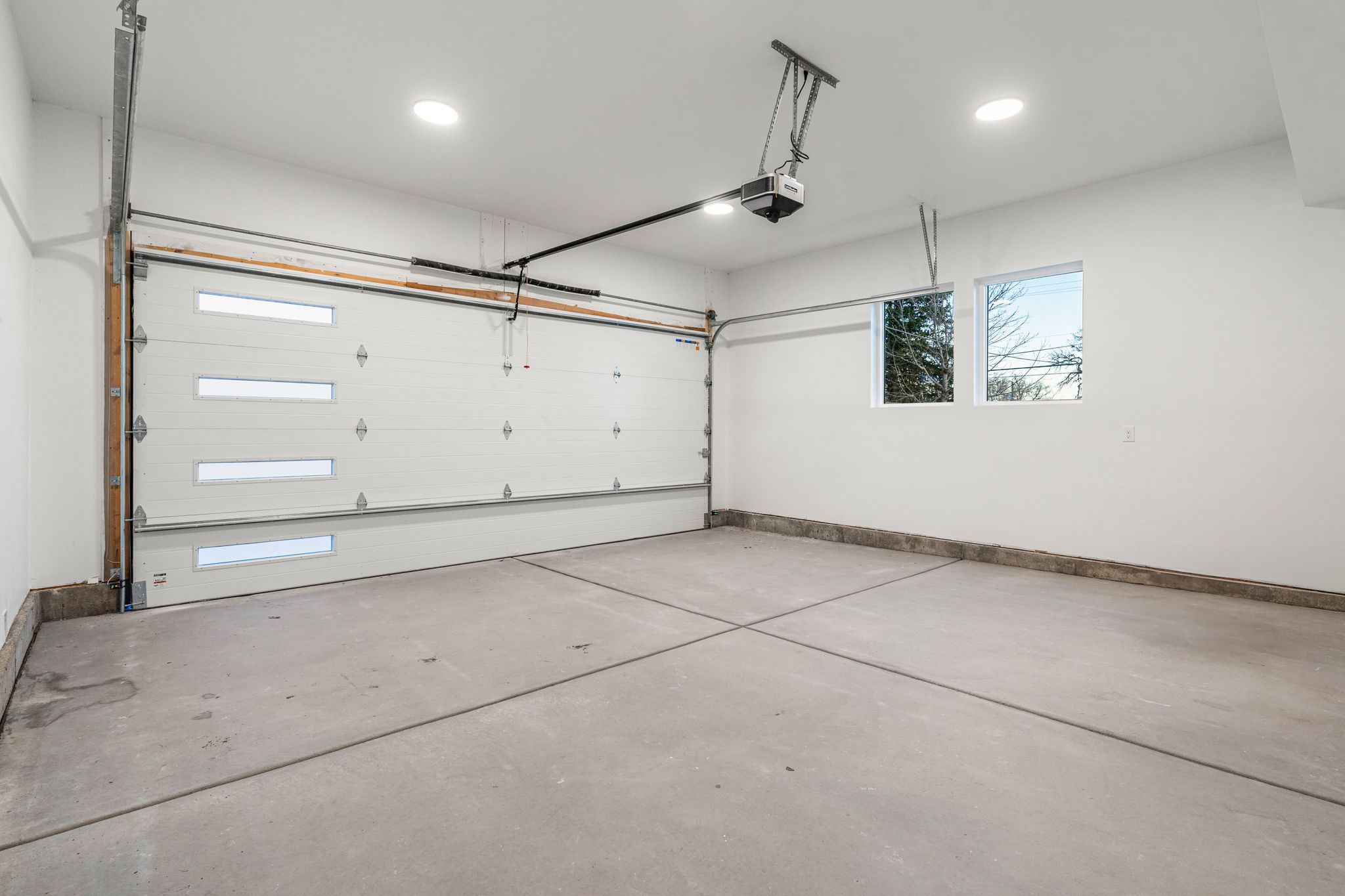 The garage interior is finished with textured and painted walls.
