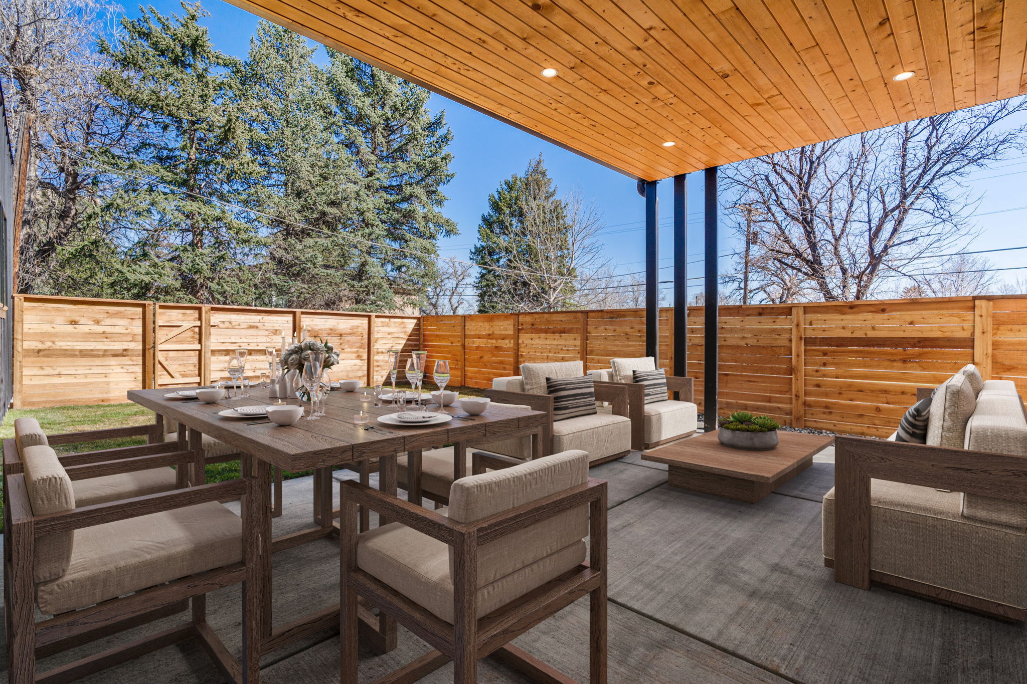 Expanded outdoor living space - covered patio with gas hook-up and fenced yard. Virtually staged.