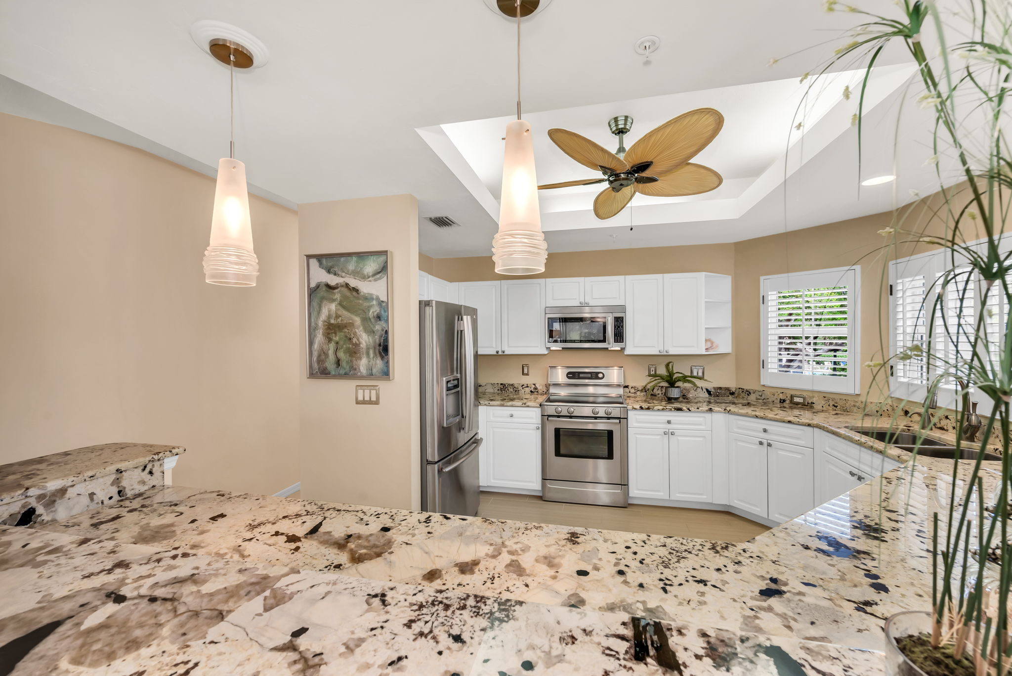 Kitchen has granite countertops and stainless steel appliances