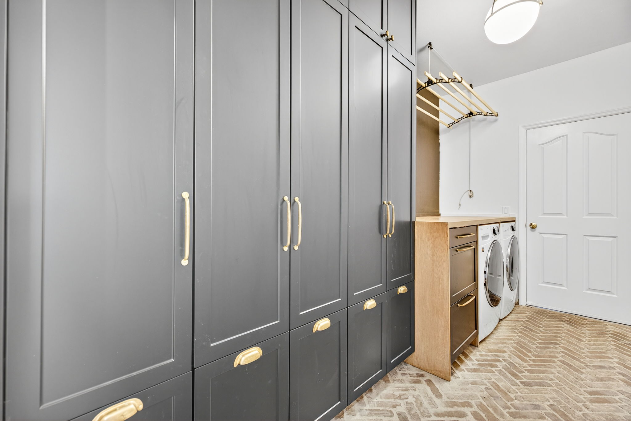 Laundry Room with storage wall