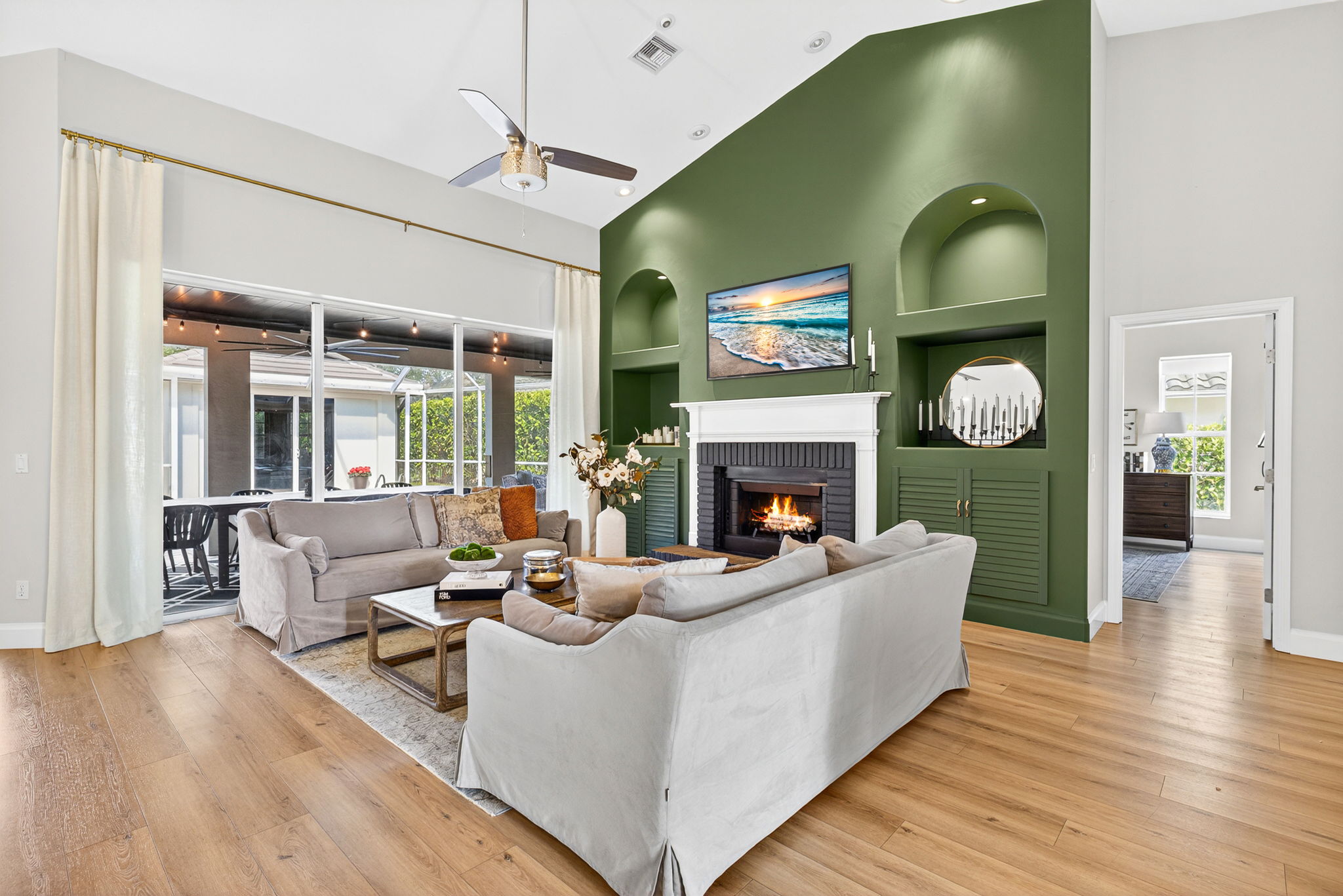 Living Room with slider to pool and lanai