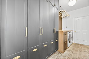 Laundry Room with storage wall