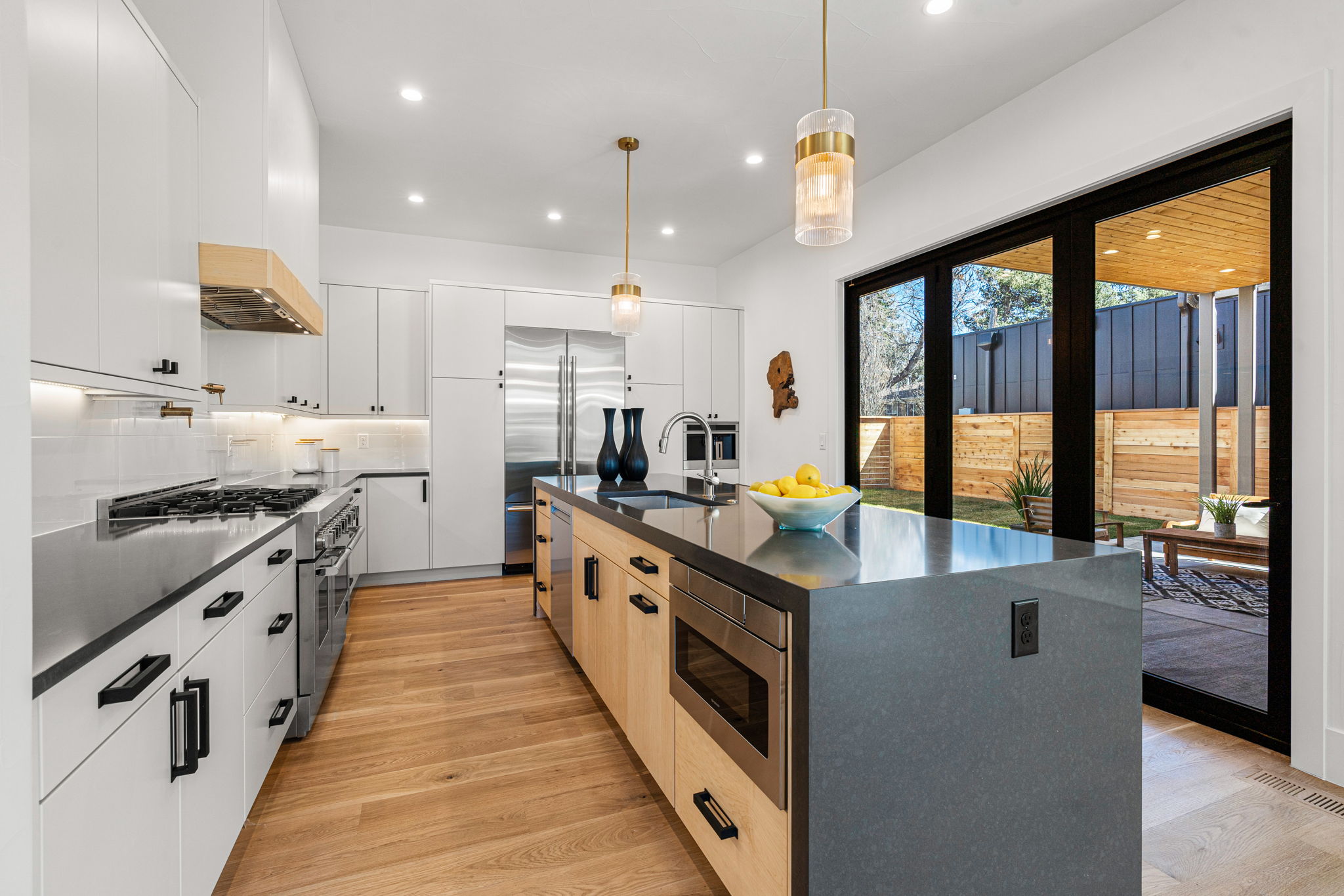Equipped with mixed metals, unique details, waterfall quartz counters, and high-end JennAir stainless appliances.