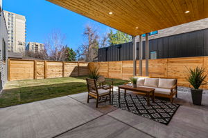 The covered back patio includes a gas line for grill or firepit hookup.