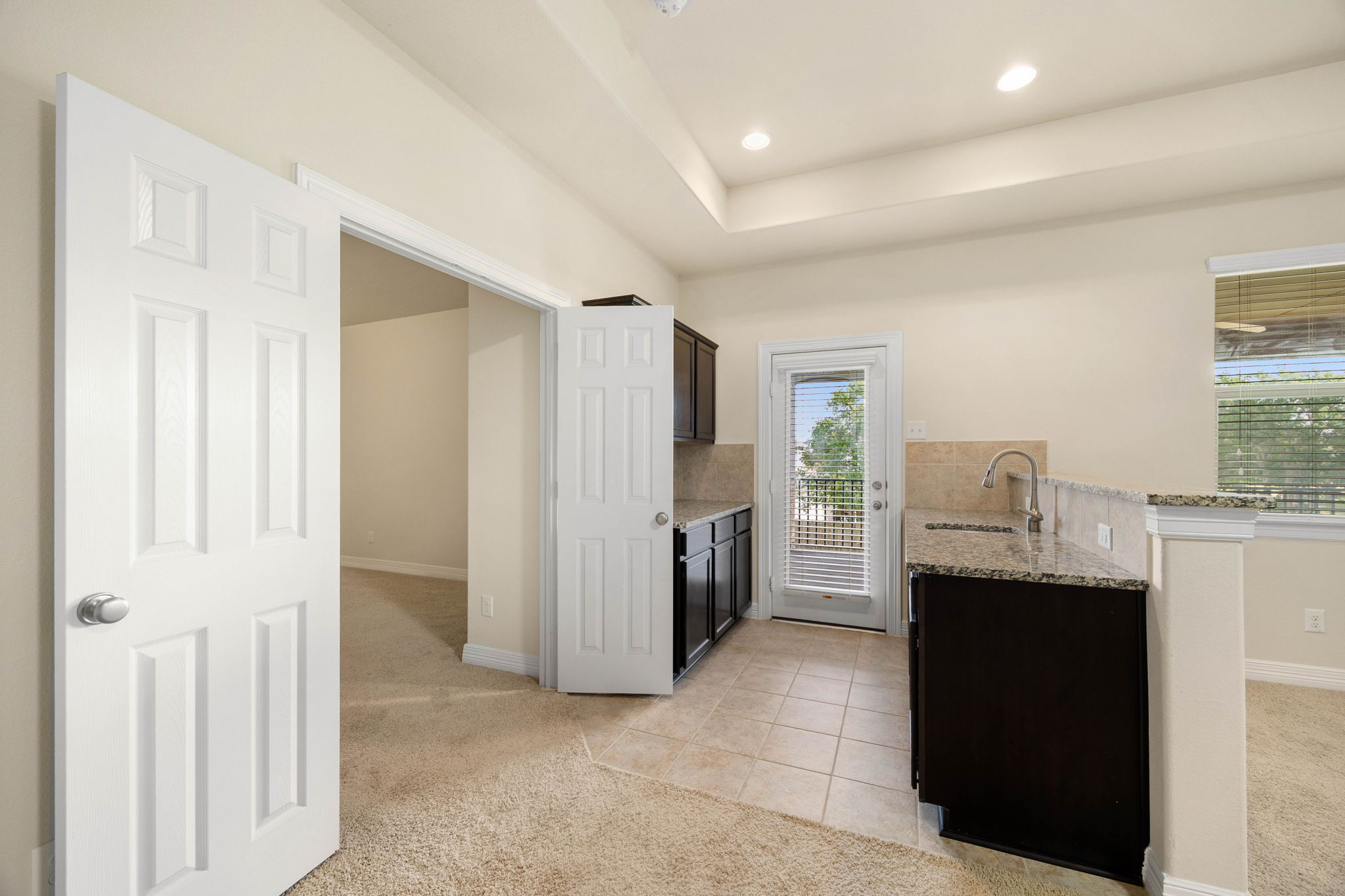 Kitchenette in Gameroom with sink and plenty of storage!