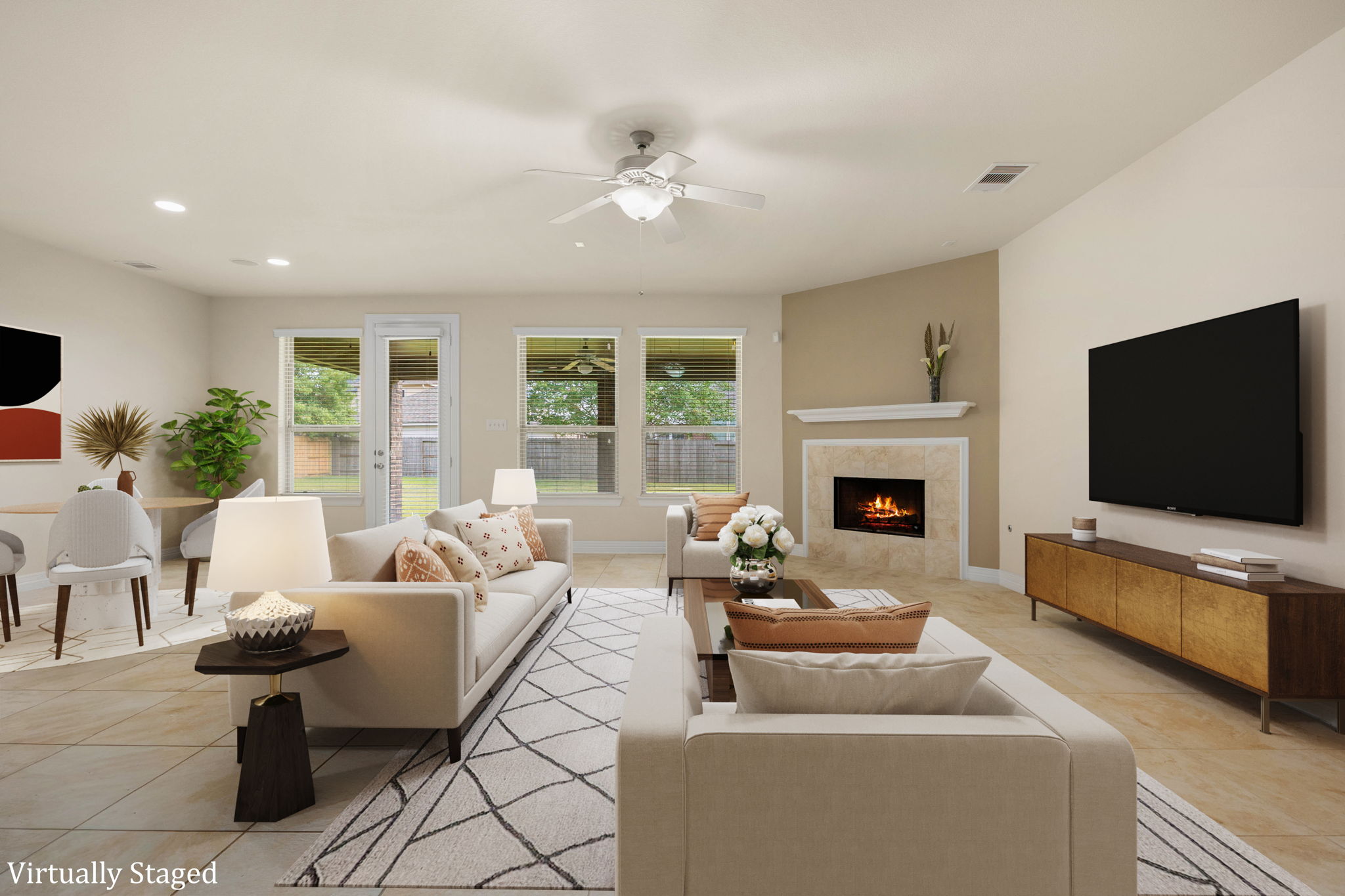 Downstairs living & breakfast area with fireplace and opens up to the Texas sized back porch.
