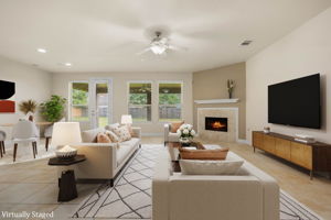 Downstairs living & breakfast area with fireplace and opens up to the Texas sized back porch.