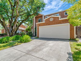 Front view with large oak tree