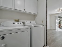 Laundry on landing from kitchen to the garage