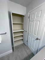 Large linen closet in hall bathroom behind door