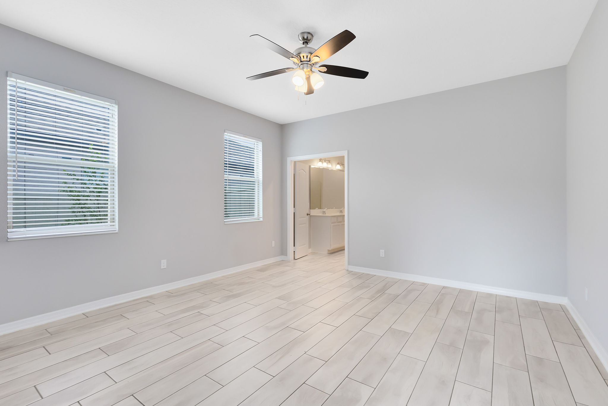 Downstairs primary bedroom suite great for multi-gen households.