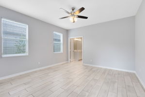 Downstairs primary bedroom suite great for multi-gen households.