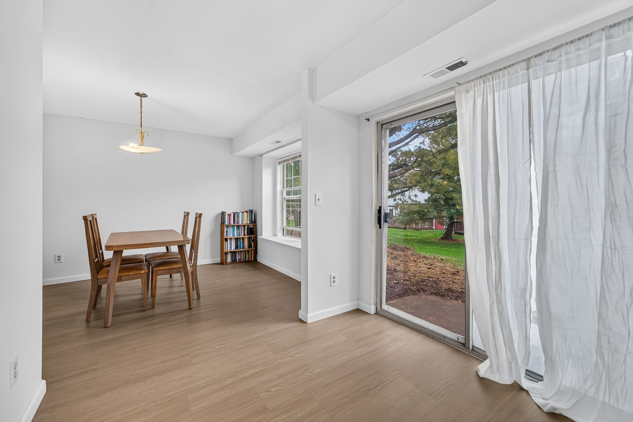 Eat-in Kitchen and Dining Room Slider opens to concrete patio.