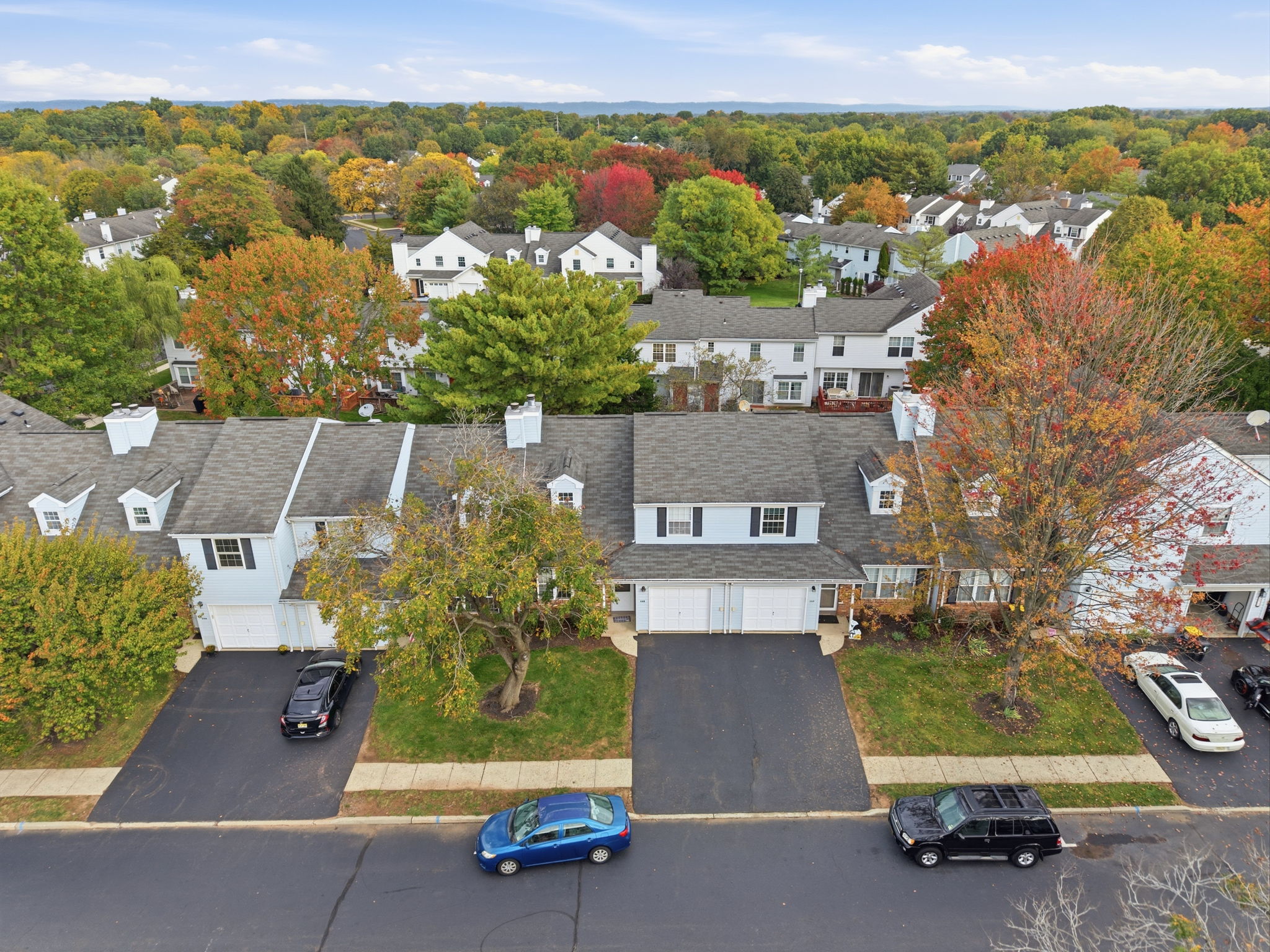 Aerial View Front -Interior Townhouse/2 Levels Brick and Vinyl Sided Exterior Pop-up Attic 1 Car Attached Garage Additional Assigned Parking