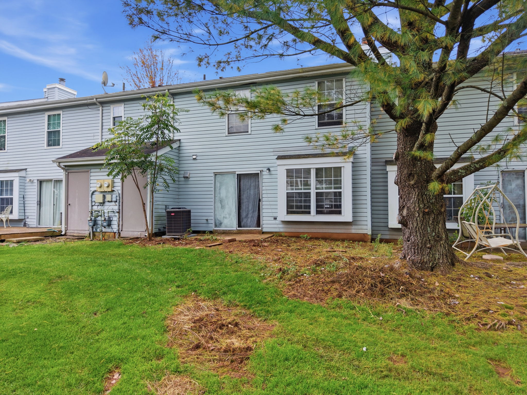 Rear View- interior Townhouse/2 Levels Brick and Vinyl Sided Exterior Pop-up Attic 1 Car Attached Garage Additional Assigned Parking
