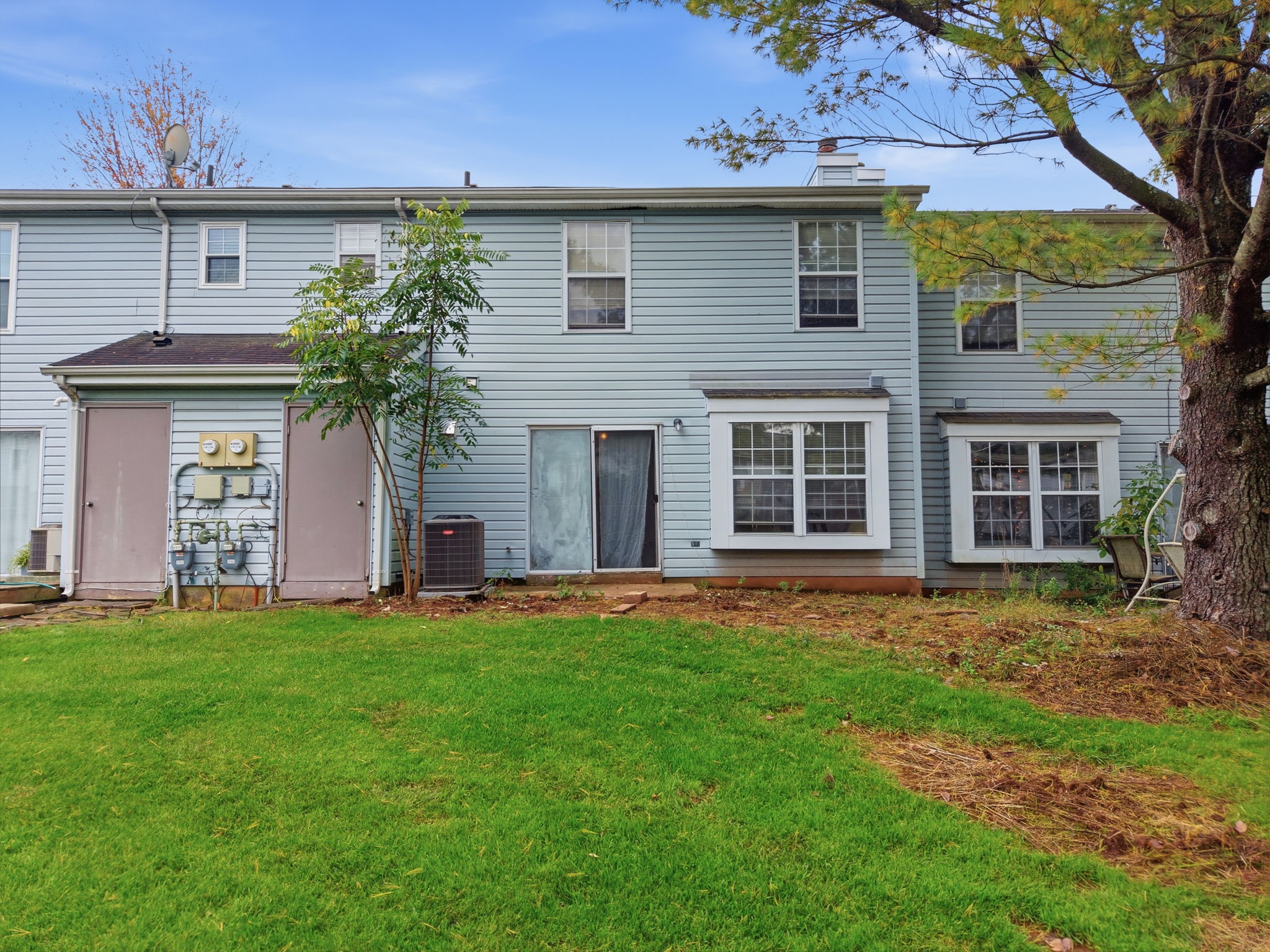 Rear View- Washing Machine - 2026 Freshly Painted 1st Level - 2025 LVP Flooring 1st and 2nd Level - 2025 Newer Faucet in Kitchen and Primary Bath Primary Bath Updated Ceramic Tile Shower and Floor HWH - 2023 AC - 2023 Gas Range - 2023