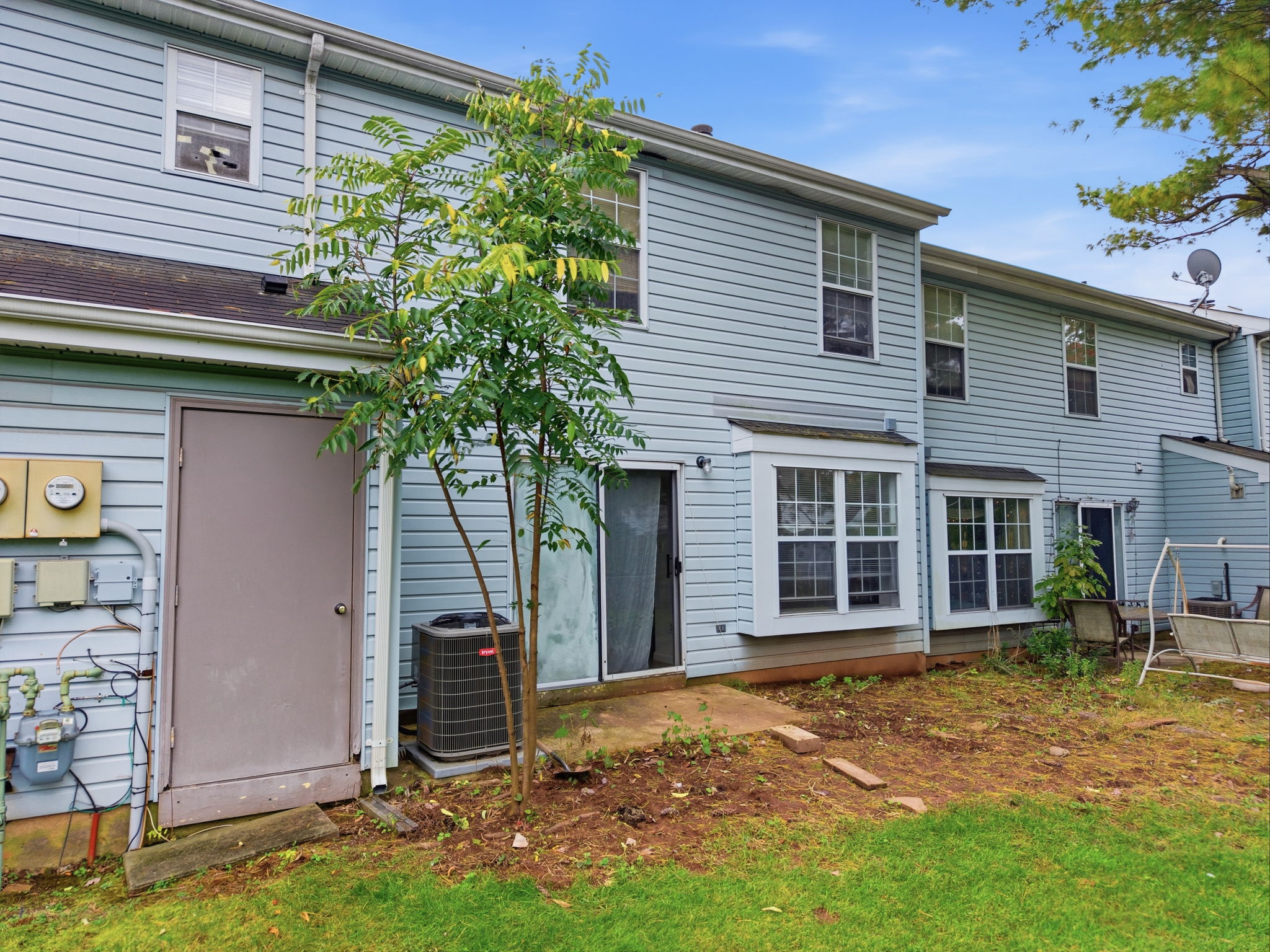 Rear View-Interior Townhouse/2 Levels Brick and Vinyl Sided Exterior Pop-up Attic 1 Car Attached Garage Additional Assigned Parking