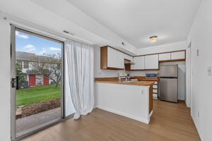 Eat-in Kitchen- European Cabinetry Wood-look Laminate Countertop Stainless Steel Sink Appliances Include: GE 5-Burner Range (2023)/Self Clean Oven/Vent Hood Dishwasher ?AS IS? Stainless Steel Refrigerator LVP Flooring - 2025